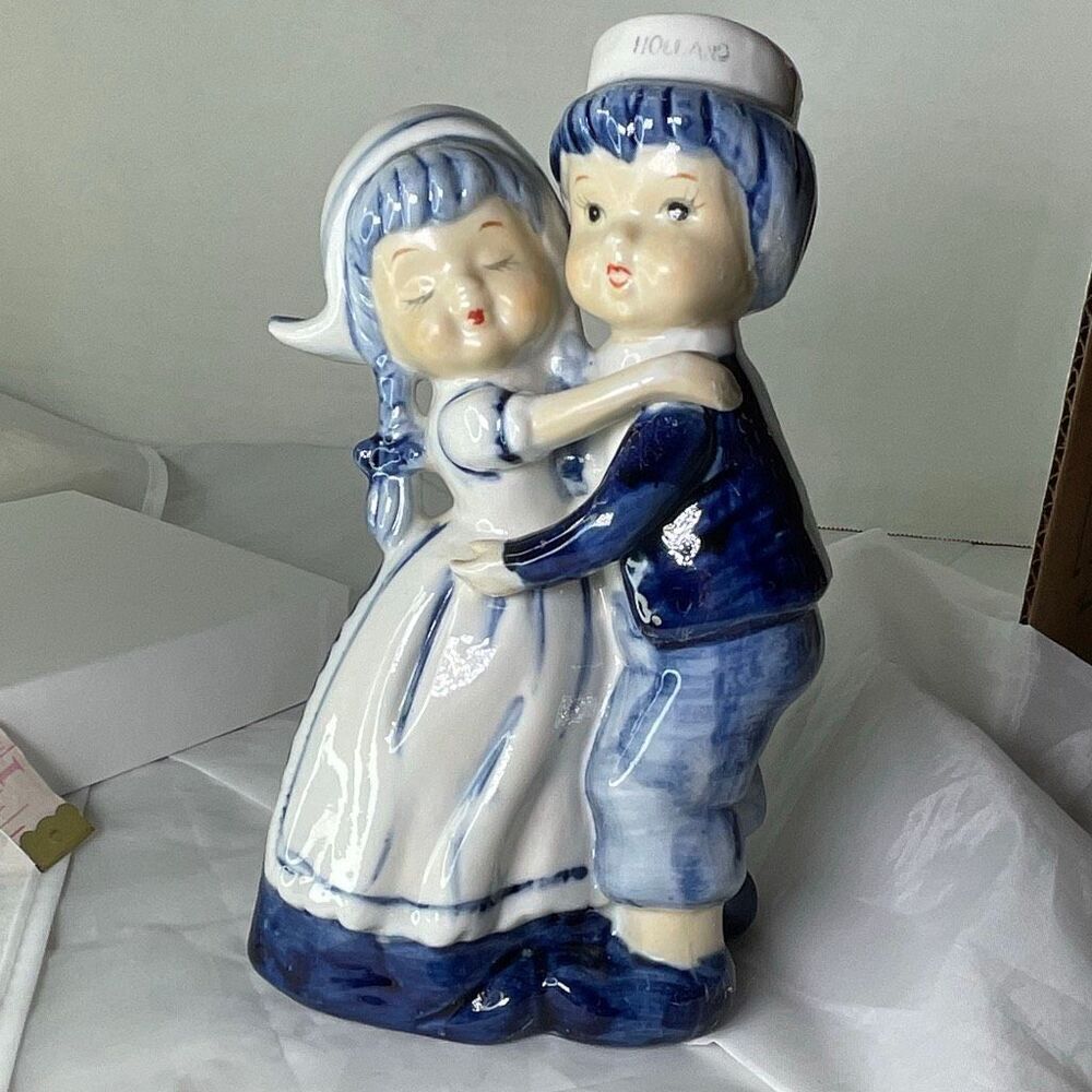 Vintage Delft Blue Dutch boy girl hugging figurine.